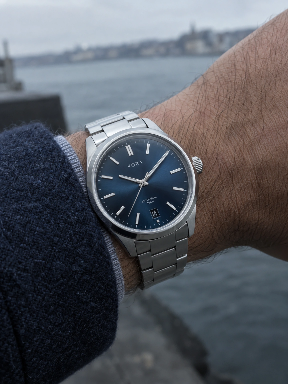 Kora watch on a wrist in cool daylight